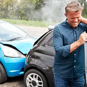 what-does-it-mean-to-be-involved-in-an-accident Injured man on the scene of a car accident